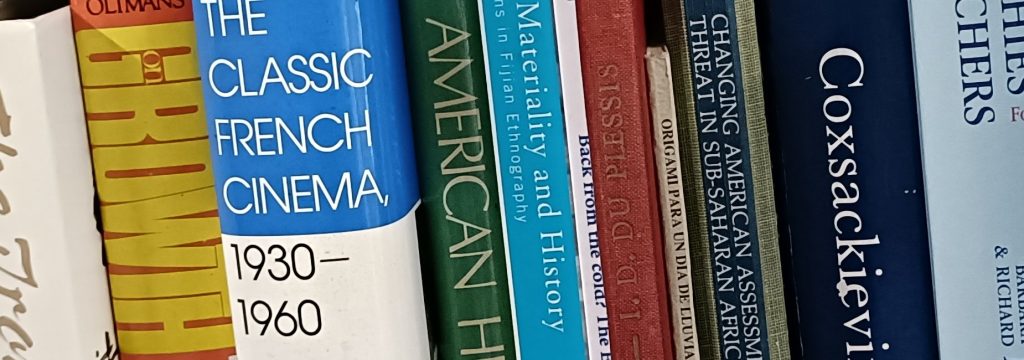 Close-up of book titles on bookshelf